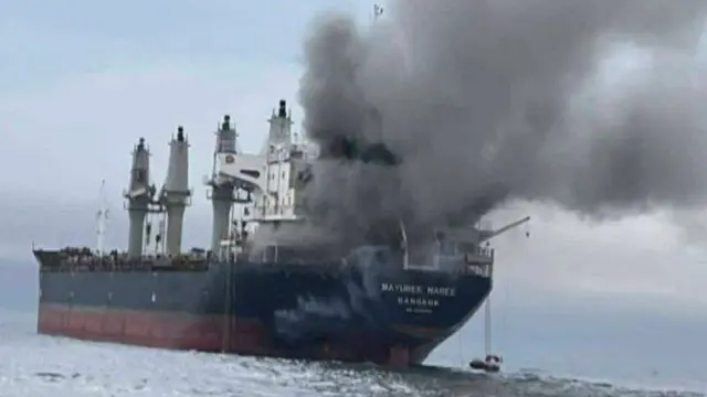 Thai cargo ship pictured with smoke and steam coming out of it