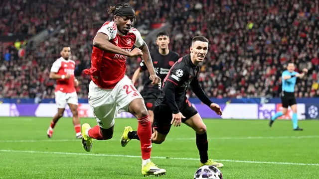 : Noni Madueke of Arsenal runs
