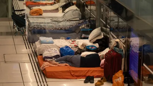 Israelis sleep in an underground tram station used as a bomb shelter in Ramat Gan, Israel