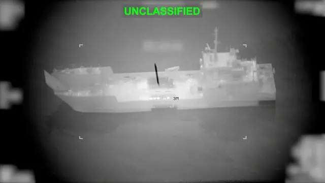 A boat is seen in a target in black and white with the words 'unclassified' written above in green