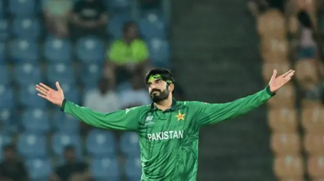 Pakistan's Usman Tariq celebrates after taking the wicket of England's Sam Curran