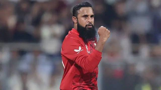 Adil Rashid of England celebrates after taking the wicket of Roston Chase of West Indies