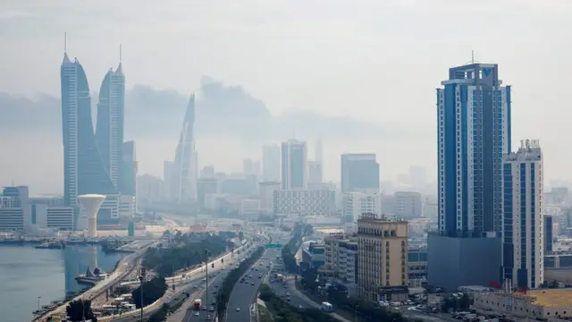 Smoke rises over Bahrain's capital Manama