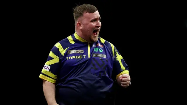 Luke Littler celebrates