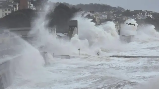 Large waves hit a sea wall in Dawlish.
