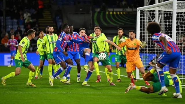 2: Jorgen Strand Larsen of Crystal Palace clashes with Marcus Rohden