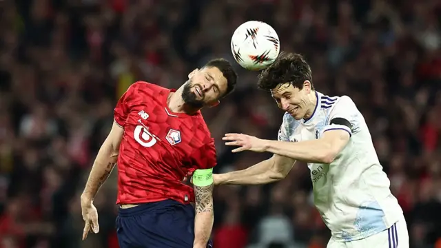Lille's French forward #09 Olivier Giroud (L) and Aston Villa's Spanish defender #14 Pau Torres