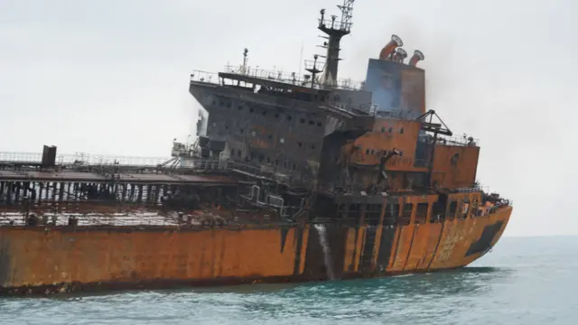A tanker carrying Iraqi fuel oil damaged after catching fire in Iraq's territorial waters, following unidentified attacks that targeted two foreign tankers
