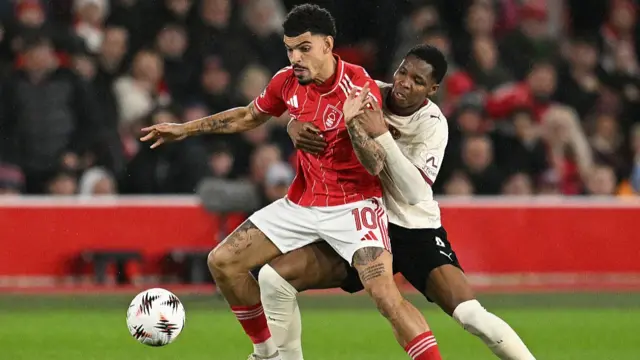 Midtjylland's Senegalese defender #04 Ousmane Diao (R) vies with Nottingham Forest's English midfielder #10 Morgan Gibbs-White d