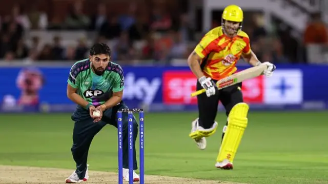 Saqib Mahmood looks on