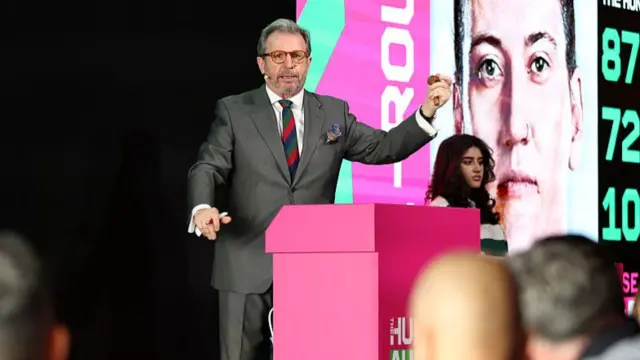 : Auctioneer Richard Madley on stage