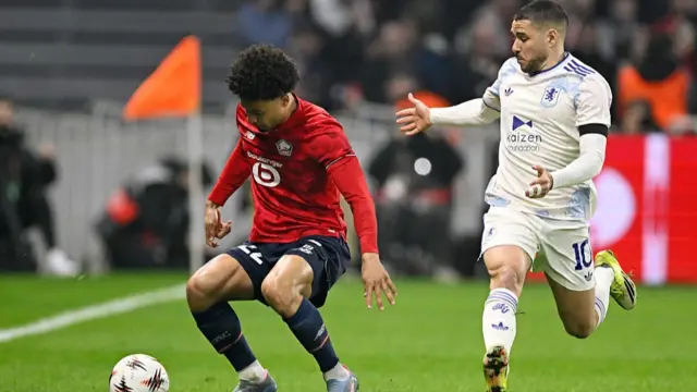 Tiago Santos of Lille OSC , Emiliano Buendia of Aston Villa FC