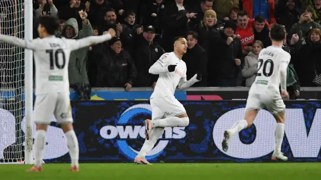 Adam Idah (centre) celebrates scoring for Swansea against Wrexham