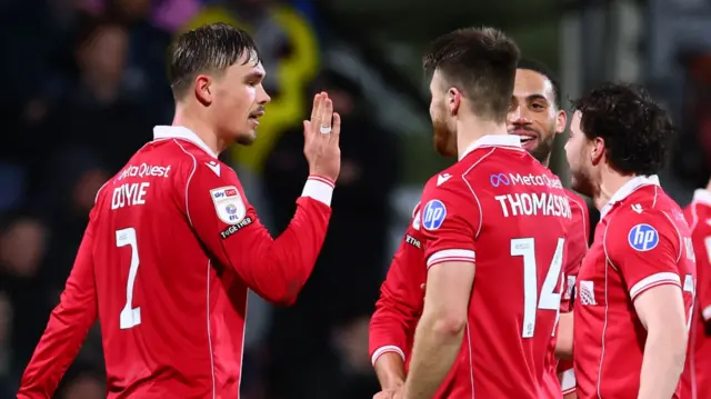 Wrexham players celebrate a goal
