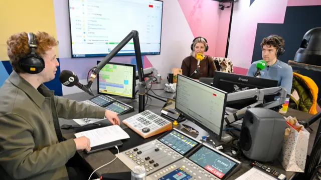 Matt, Mollie and Greg sit around a radio studio