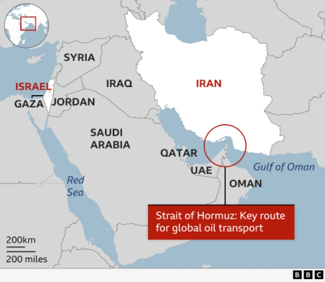 Map of the Middle East with Iran and Israel highlighted in white. A red circle connected to a red text box indicates the area known as the Strait of Hormuz, located between the Persian and Oman Gulfs