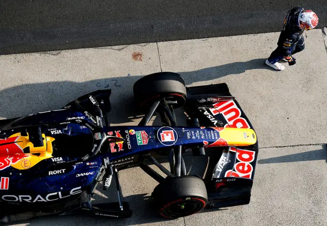 Max Verstappen walks away from his Red Bull
