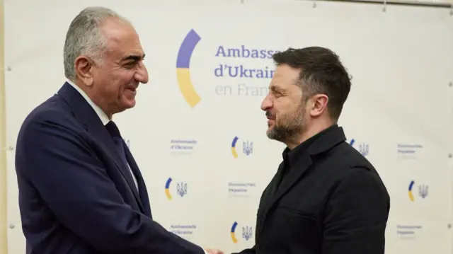 Reza Pahlavi shakes hands with Volodymyr Zelensky in Paris