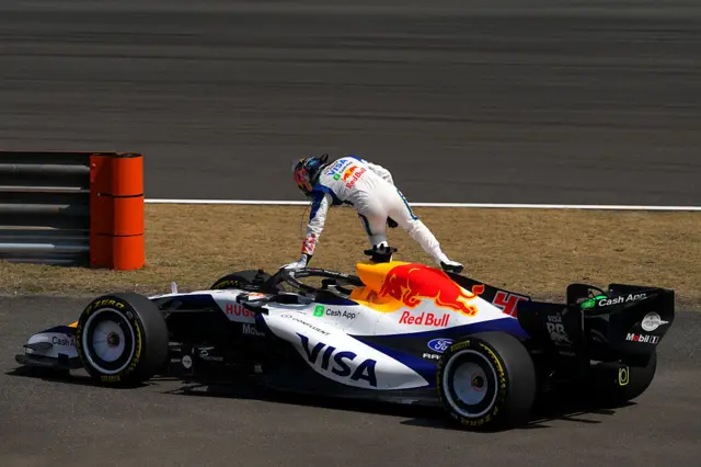 Arvid Linblad gets out of his car after stopping in China first practice
