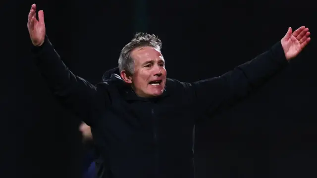 Phil Parkinson with his arms outstretched