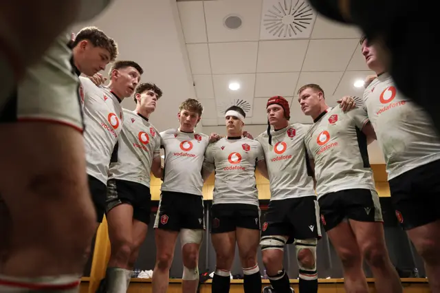 Wales in a huddle in their dressing room in Dublin