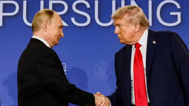 Putin and Trump shake hands