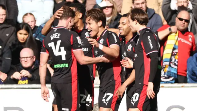 Kuryu Matsuki celebrates with his Southampton team-mates