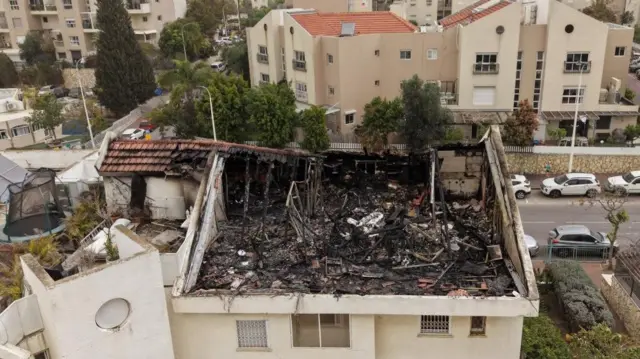 A damaged building after a reported overnight missile strike hit a residential area near the city of Shoham, central Israel