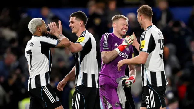 Newcastle players celebrate victory over Chelsea