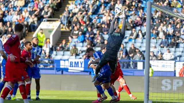 Sheffield Wednesday goalkeeper Pierce Charles catches a cross
