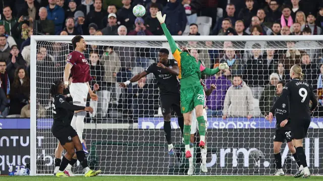 Donnarumma misses the ball as he attemps to clear it