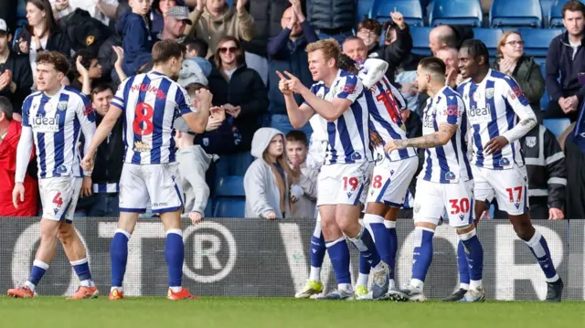 Aune Heggebo celebrates with his West Brom team-mates