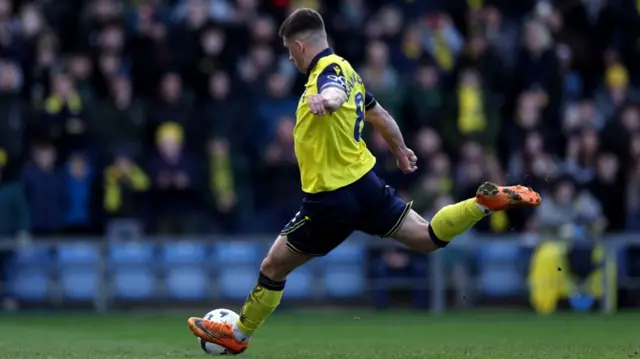 Cameron Brannagan scores from the penalty spot