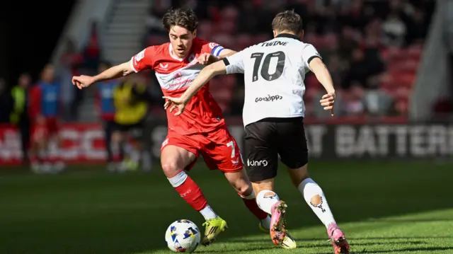 Hayden Hackney takes on Bristol City's Scott Twine