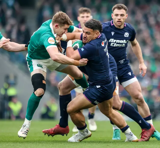 Ireland's Garry Ringrose tackles Scotland's Sione Tuipulotu
