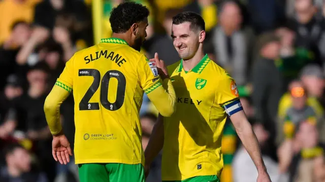 Anis Slimane celebrates with Kenny McLean