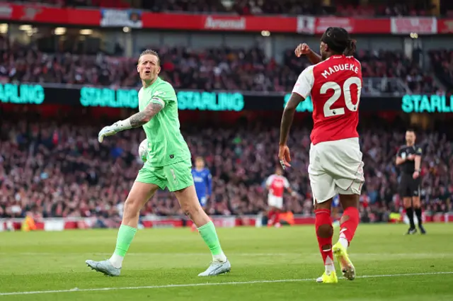 Jordan Pickford of Everton remonstrates with Noni Madueke
