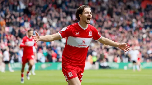 Middlesbrough's Leo Castledine celebrates with his arms out