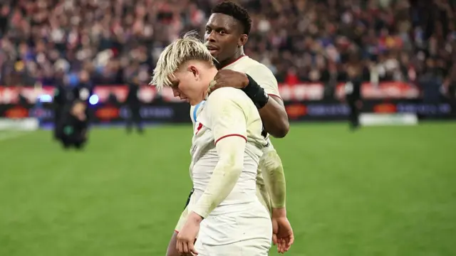 Henry Pollock consoled by Maro Itoje