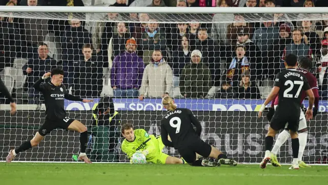 Hermansen makes a save from a Rodri header