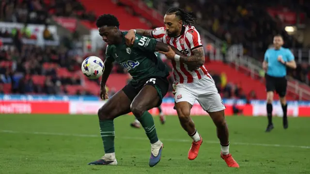 Sorba Thomas battles for the ball against Watford
