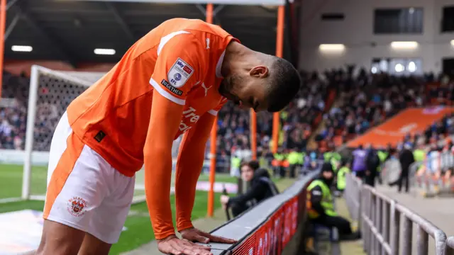 Blackpool's Ashley Fletcher looks dejected after their defeat to Wigan