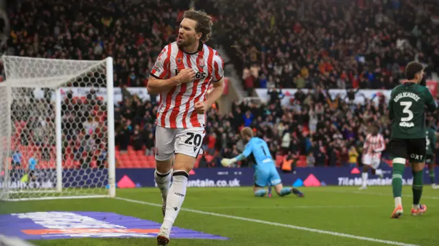 Stoke goalscorer Sam Gallagher taps his chest in celebration