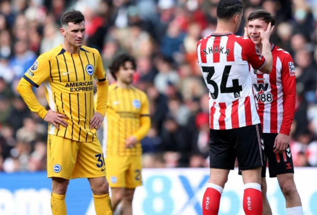 Sunderland's Granit Xhaka and Chris Rigg react
