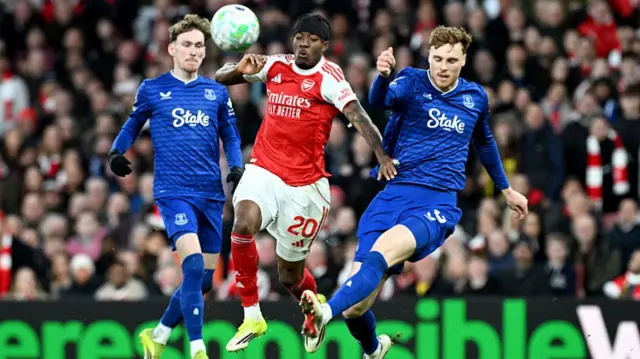 Noni Madueke is challenged by Jake O'Brien