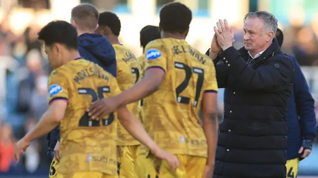 Blackburn boss Michael O'Neill claps the travelling fans with his players