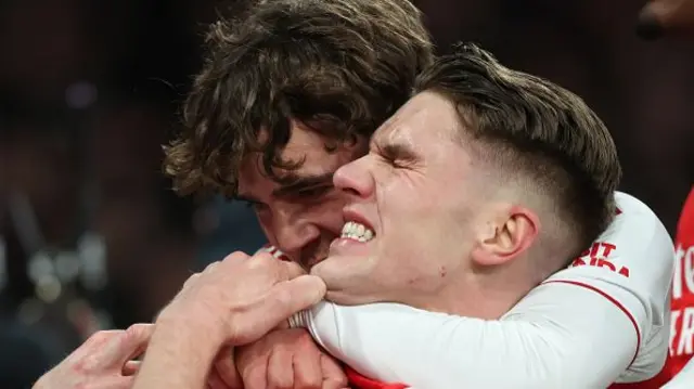 Max Dowman of Arsenal grabs hold of Viktor Gyokeres