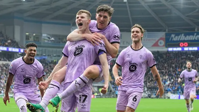 Lincoln celebrate their winner at Cardiff last Saturday