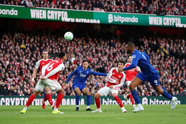 Everton's Dwight McNeil takes a shot that hits the post