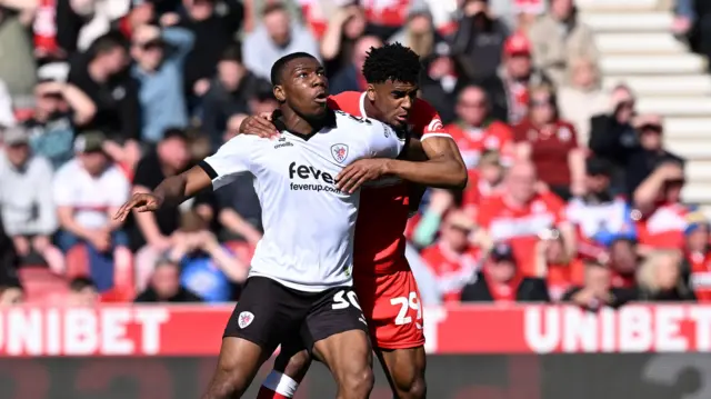 Bristol City striker Sinlair Armstrong battles for a header with Middlesbrough defender Adilson Malanda